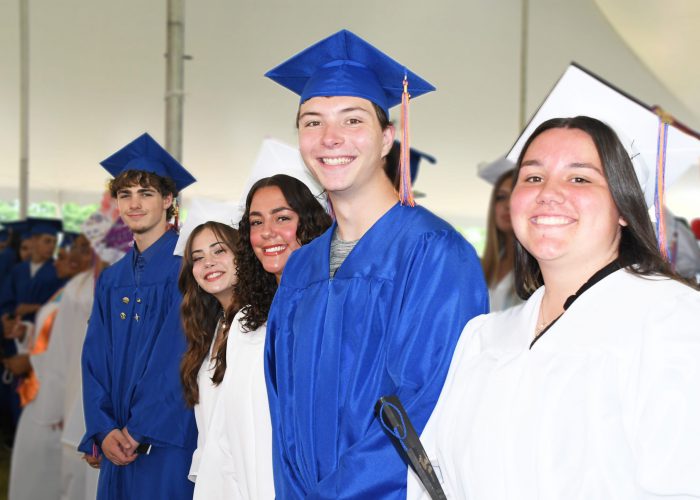 Students process into graduation