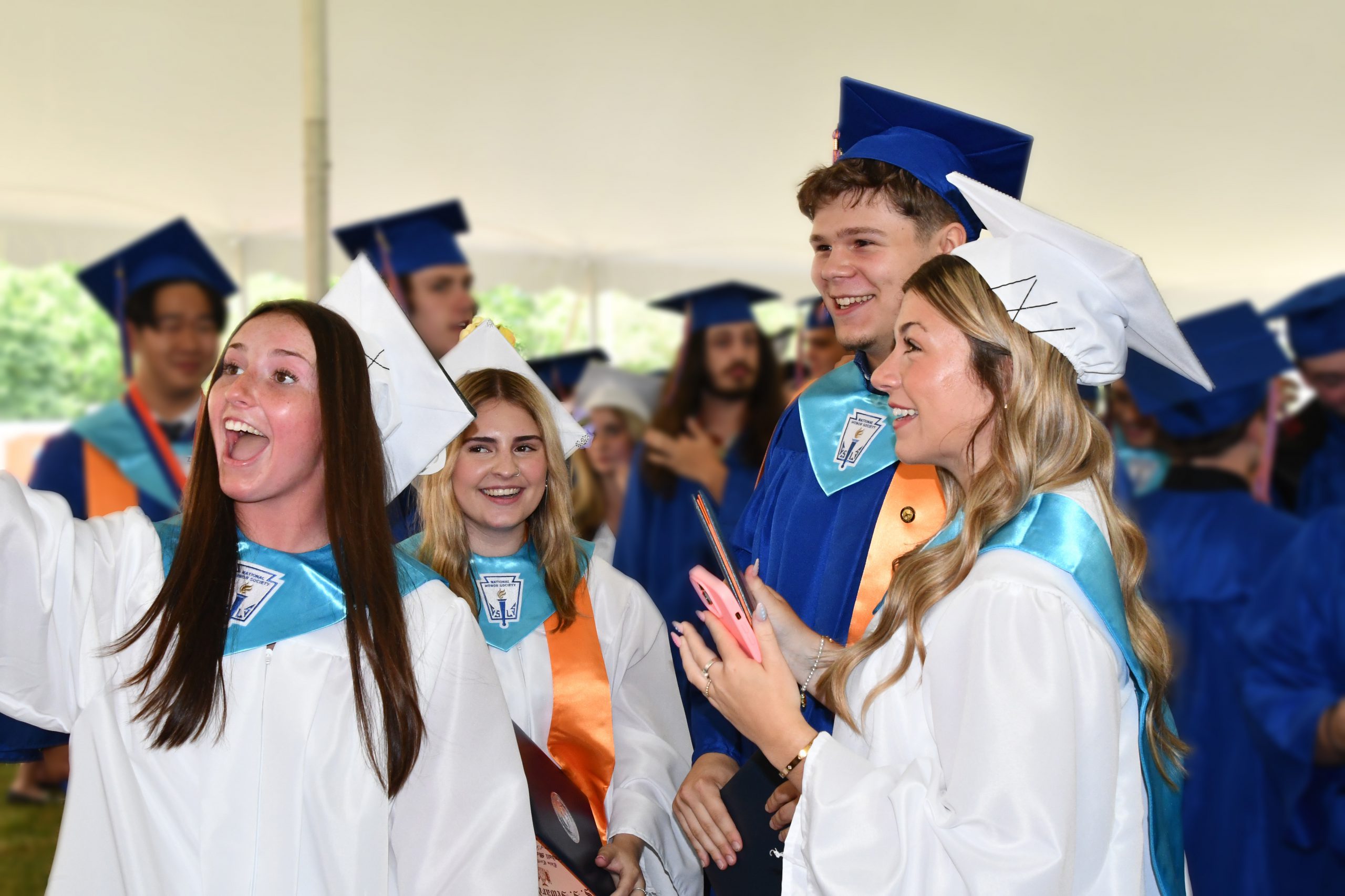 students celebrate after graduation