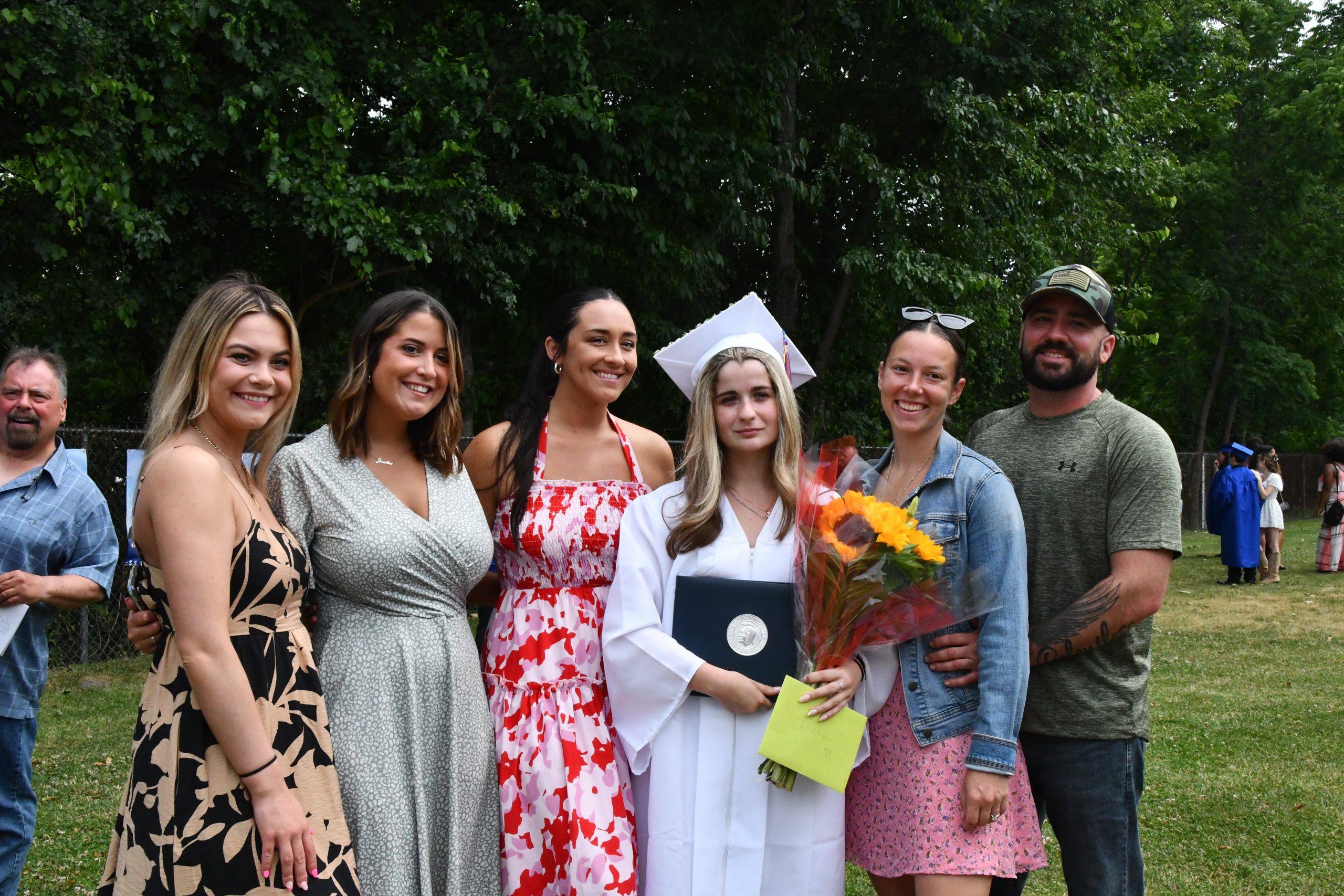 family poses with graduate