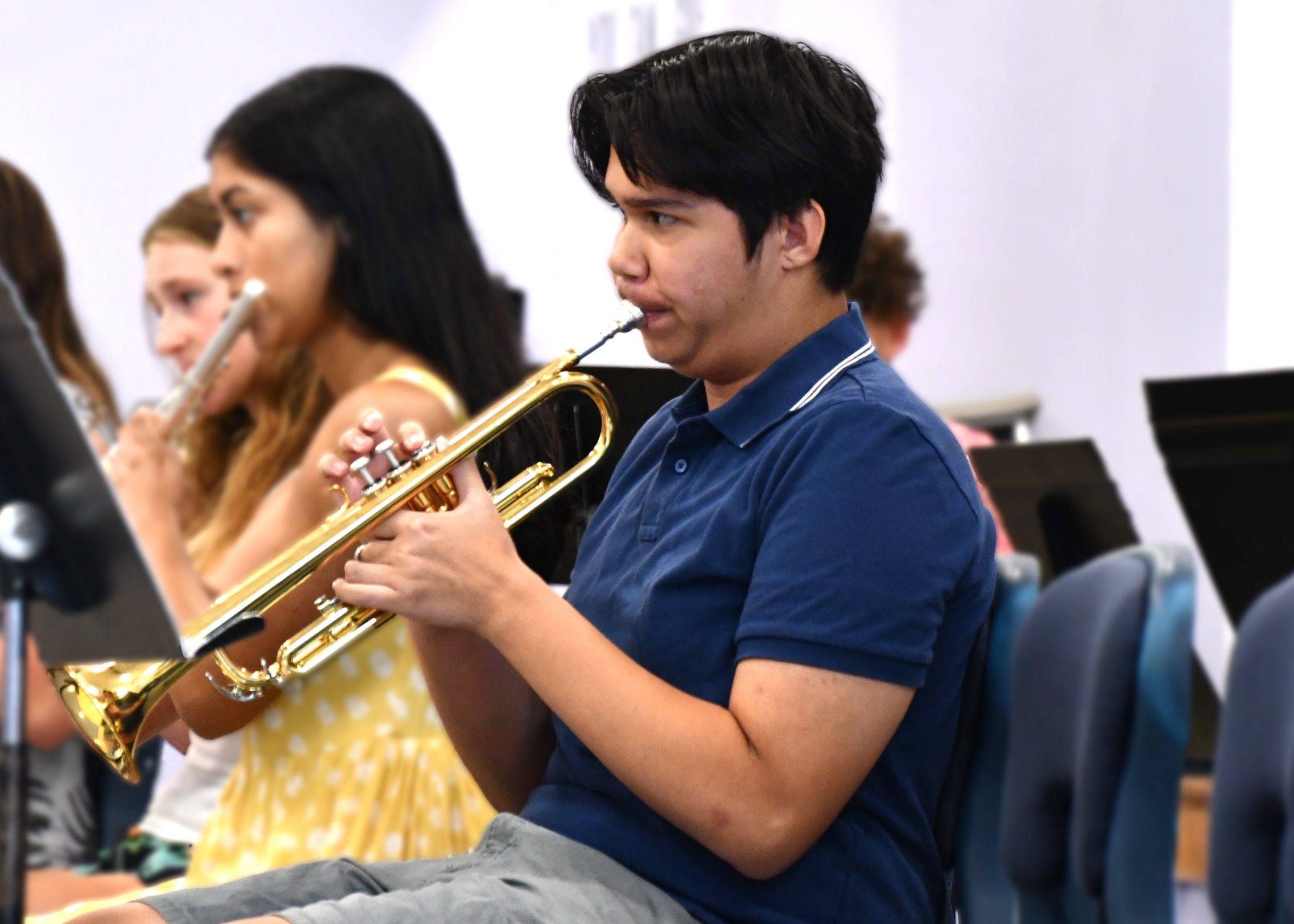 trumpet plays at summer band concert