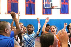 team comes together for a cheer before a break at volleyball tryouts