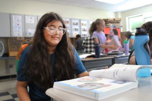 student explores magnetic reading book