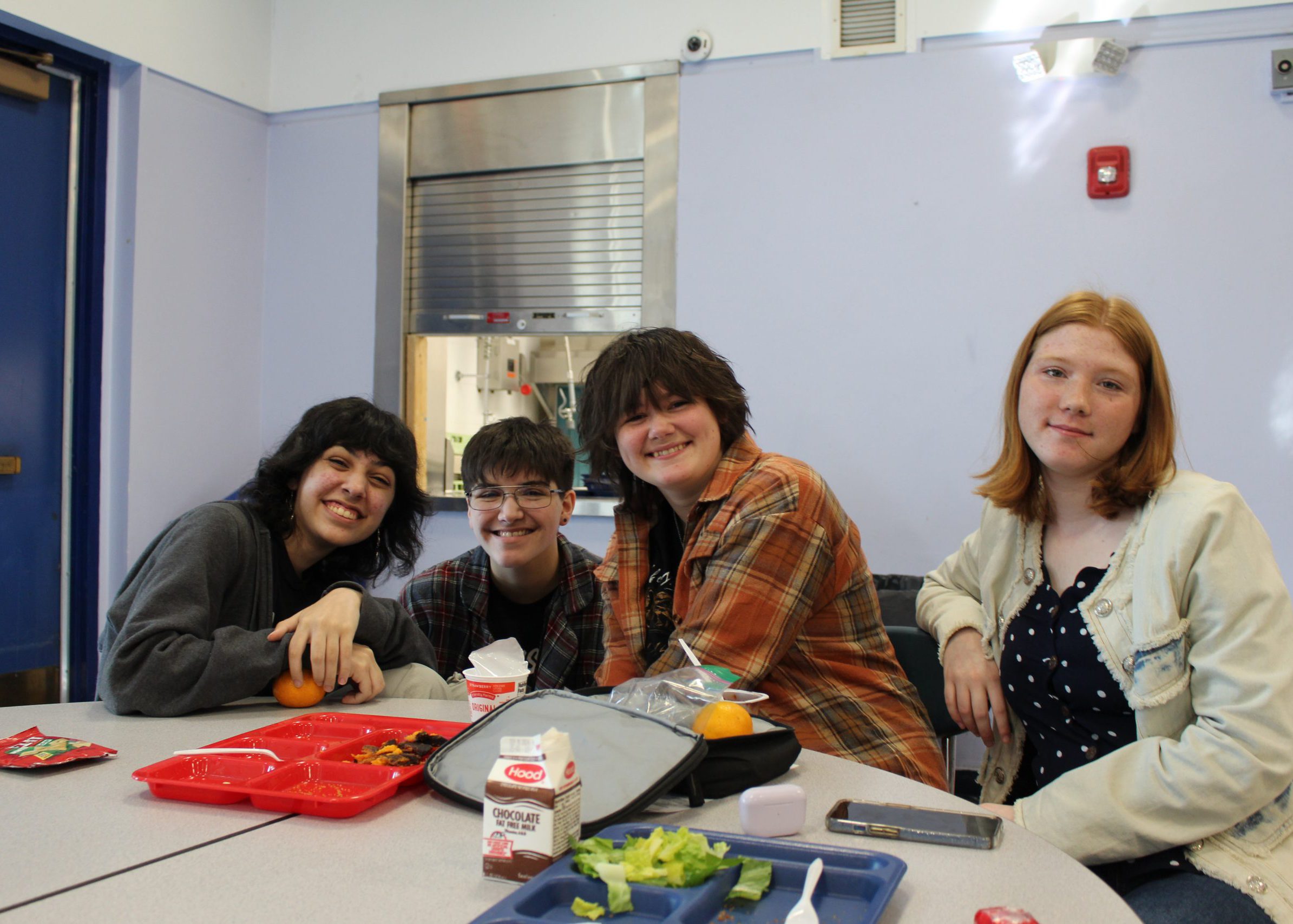 students smile for the camera at lunch