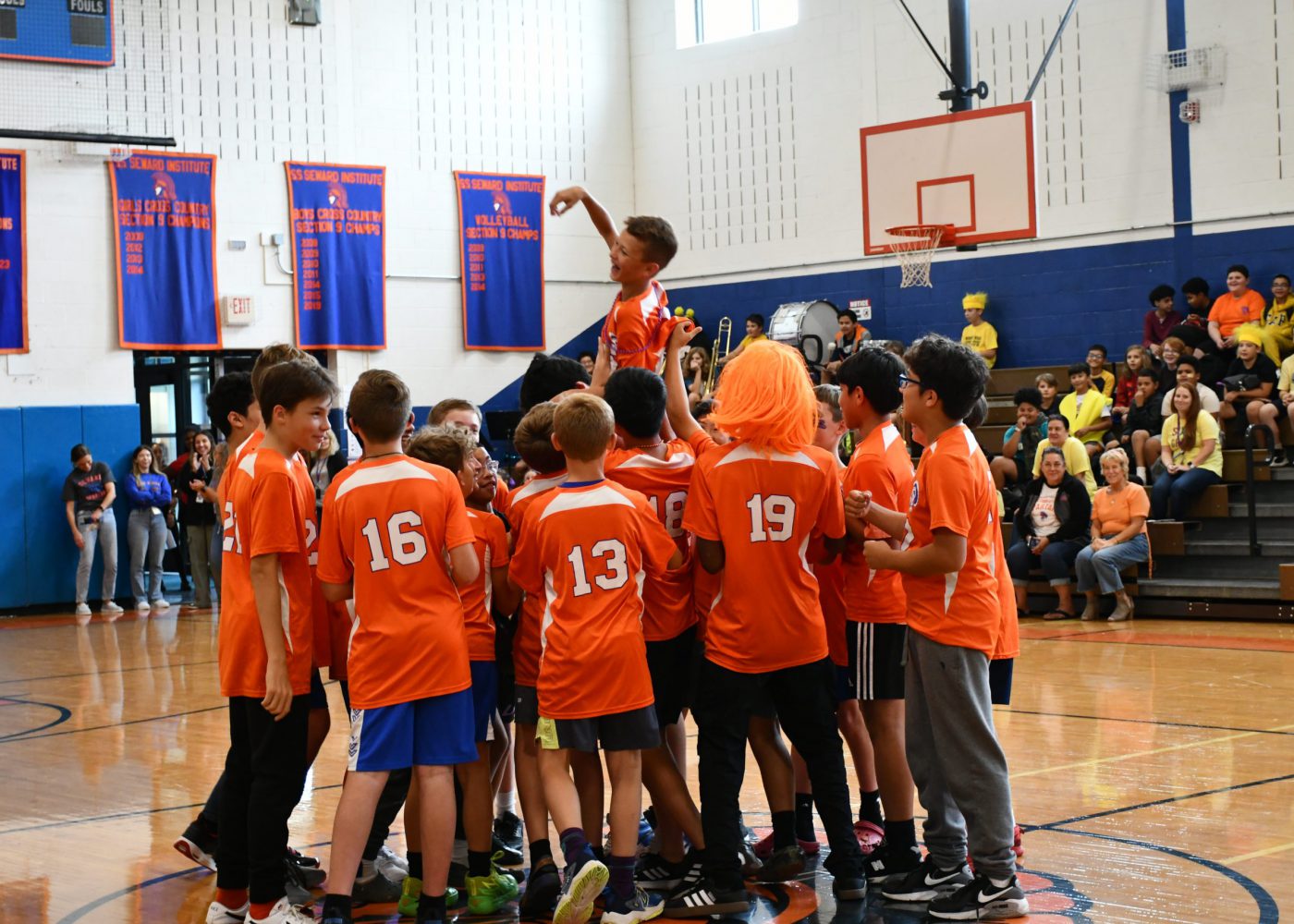 teams make an entrance into the pep rally