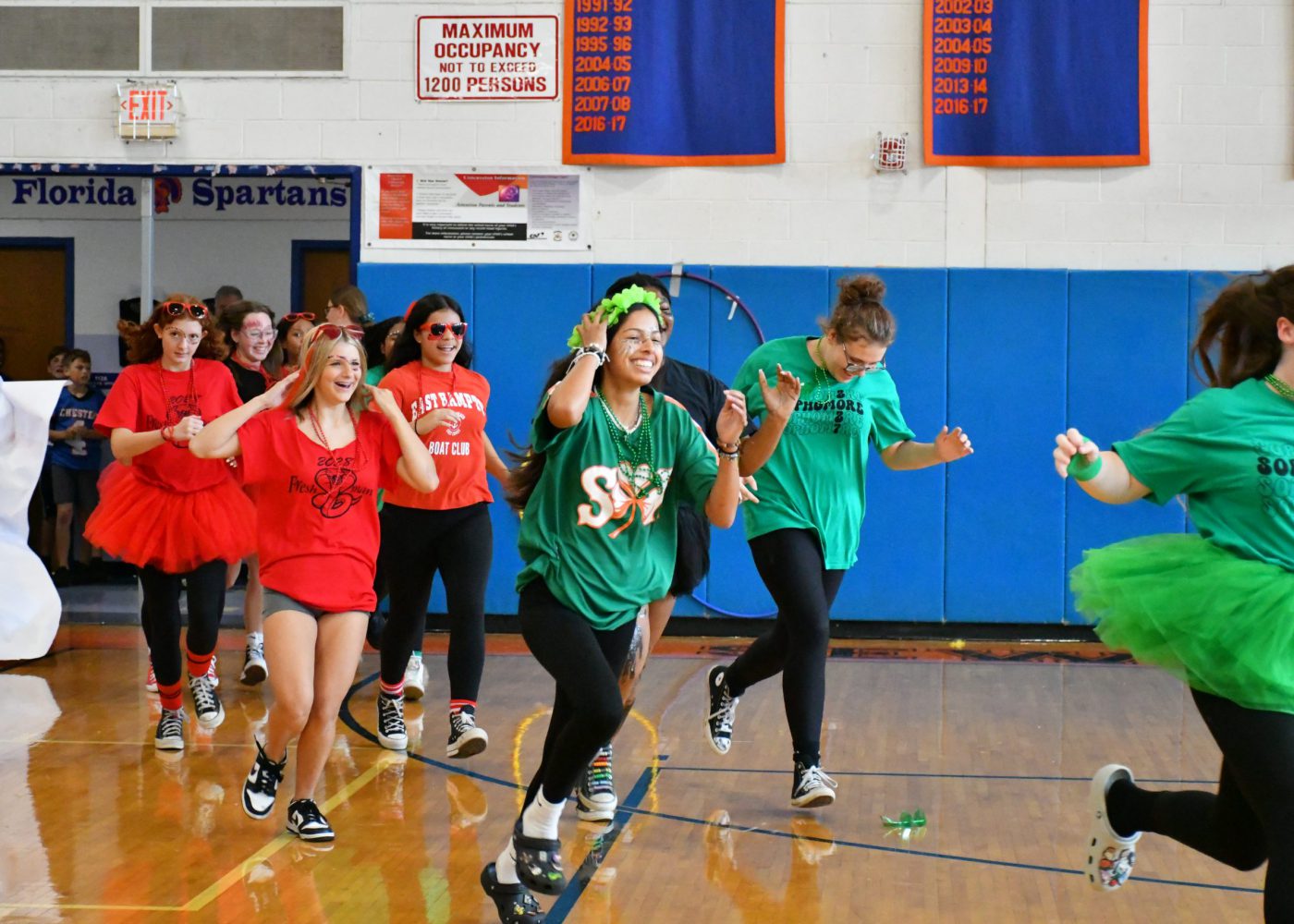 teams make an entrance into the pep rally