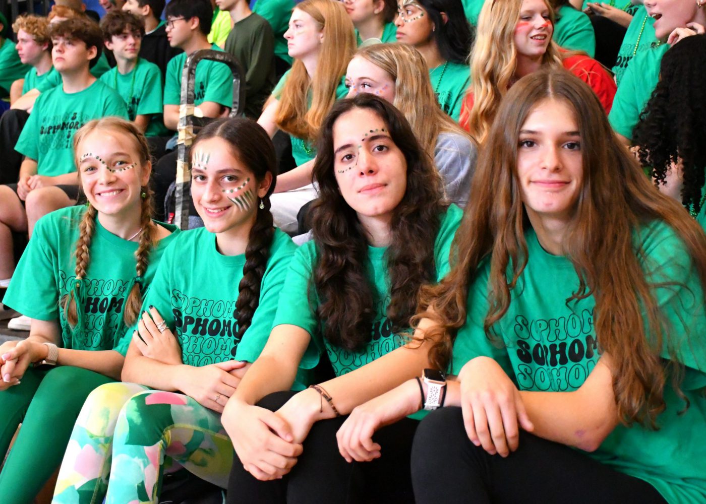 Students dressed in their class color smile for the camera