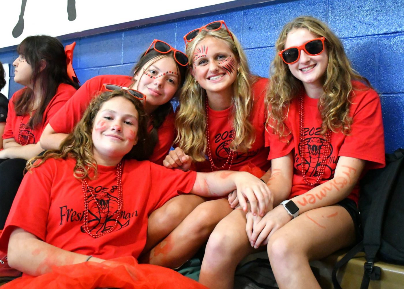 Students dressed in their class color smile for the camera