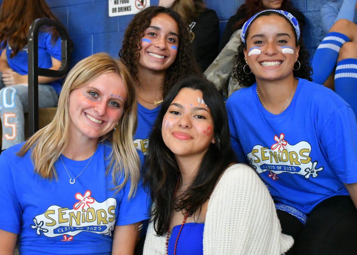 Students dressed in their class color smile for the camera