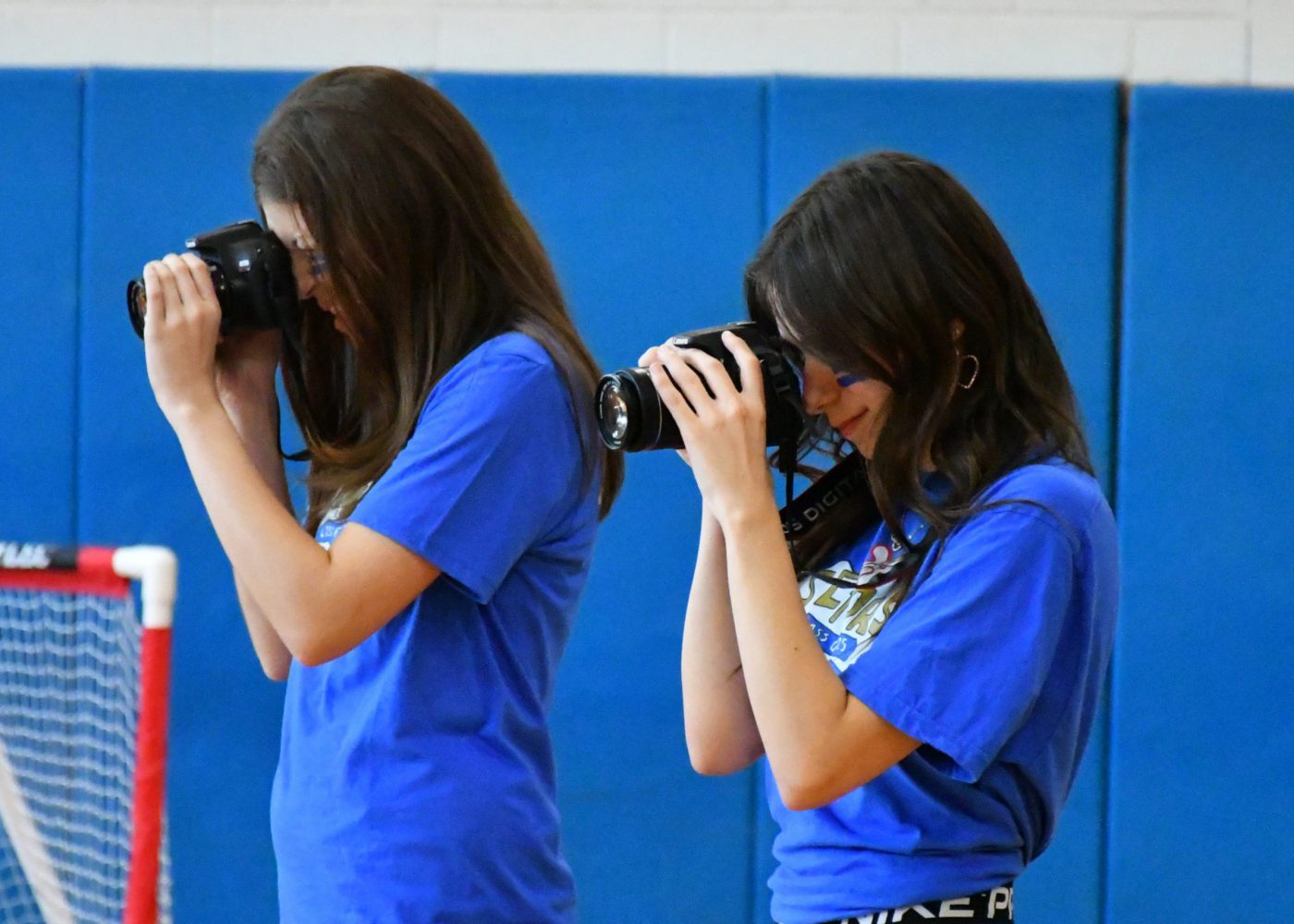 student photographers capture moments during the pep rally