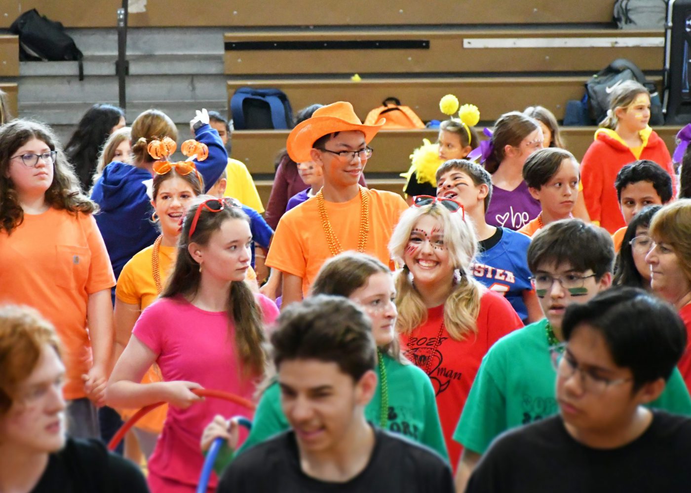 students fill the court preparing for a hula hoop game