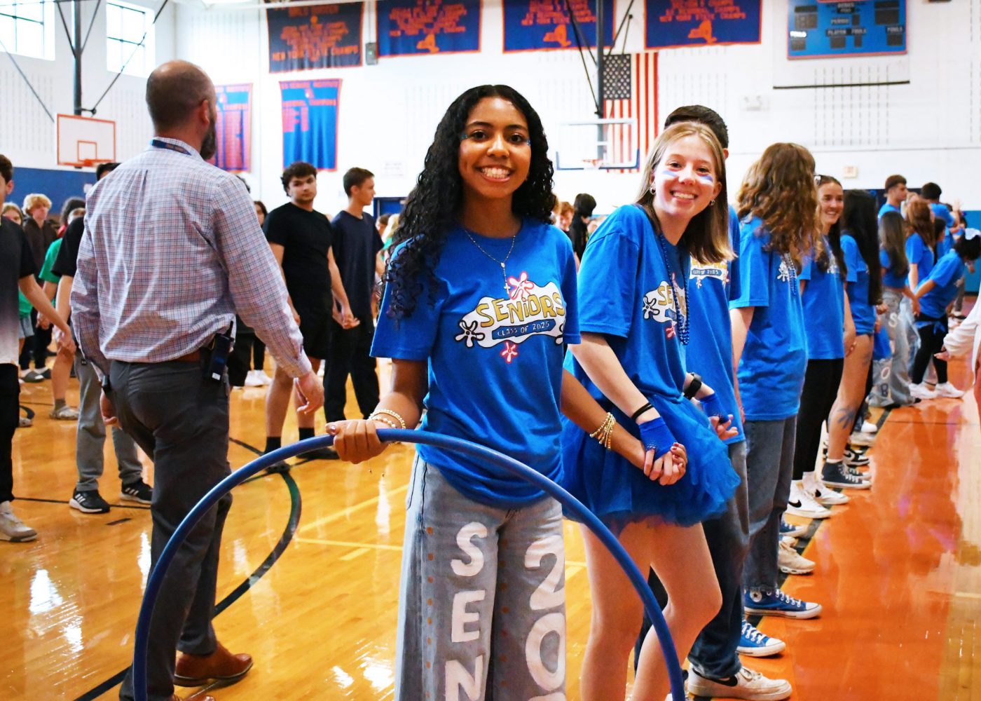 students fill the court preparing for a hula hoop game