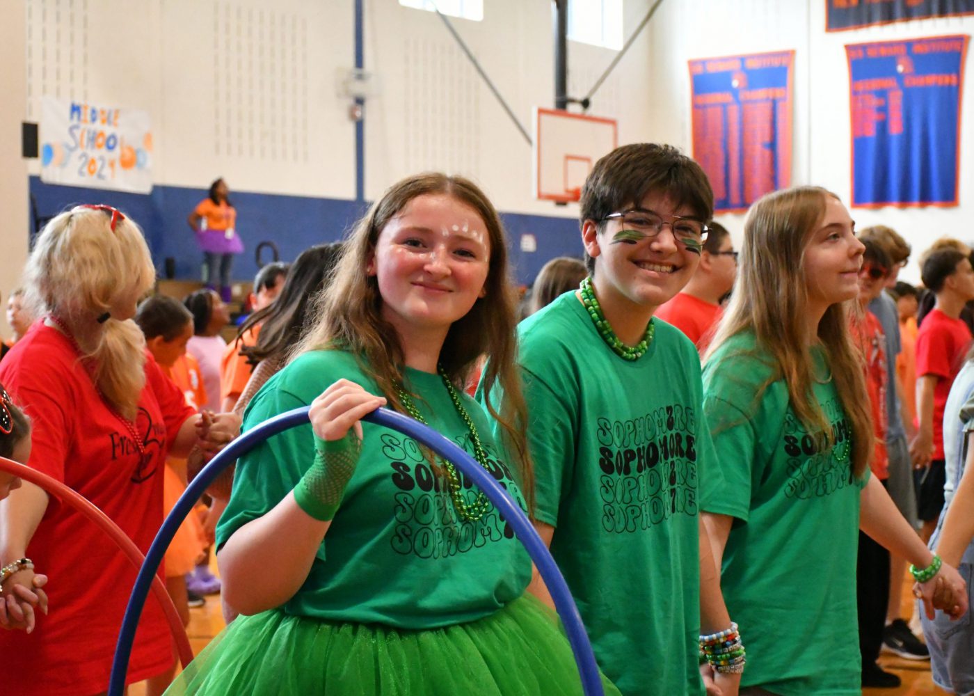 students fill the court preparing for a hula hoop game