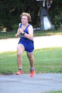 Nate Lever runs in a cross country race