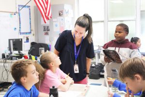 teacher and student discuss the math activity