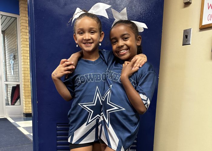 students show off their outfits on twin day