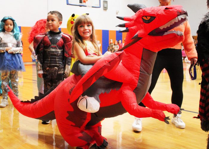 students smile at costume parade