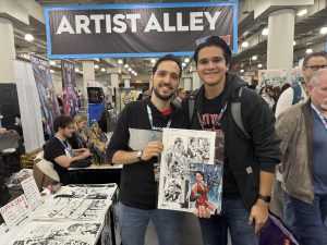 Milo Janata with an artist at Comic Con