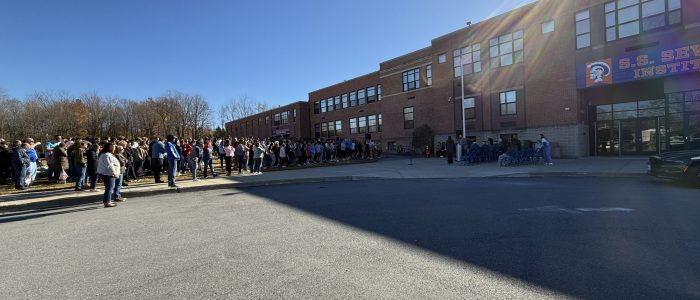 Students and staff attend flag raising ceremony for veterans day