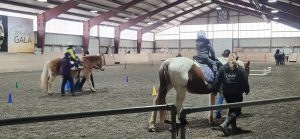 Students riding horses at Winslow