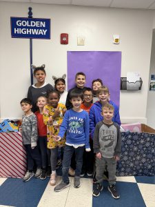 Students pose with toys they collected