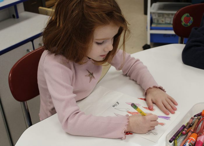 Student working on valentines day project