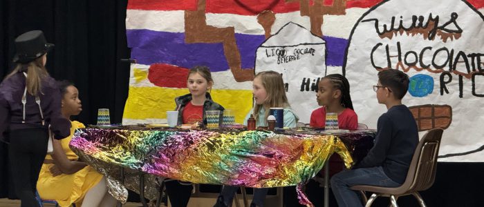 Students performing at Odyssey of the Mind Tournament