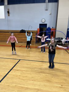 Students jump rope in gym class